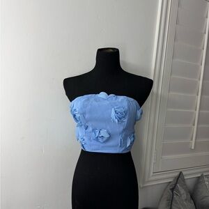 Elegant Blue Strapless Top with Floral Accents